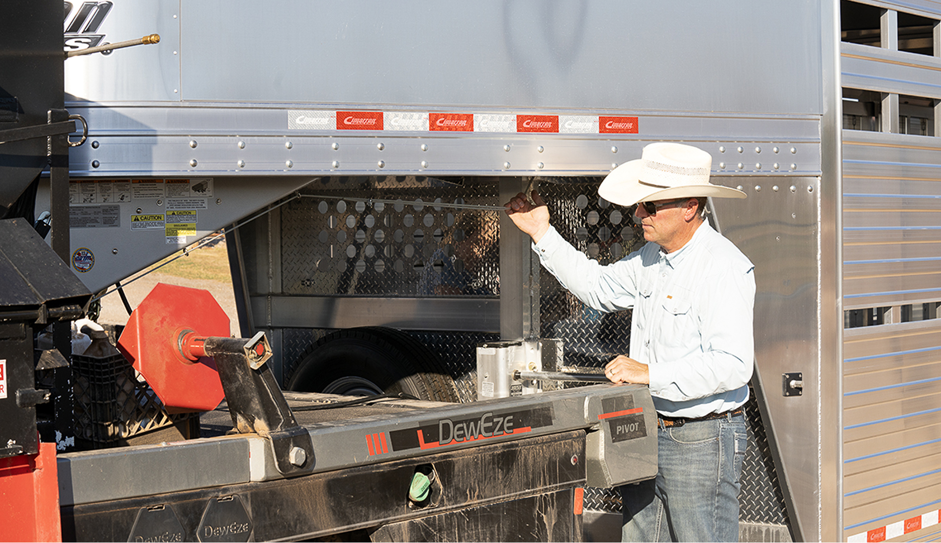 Farmer next to trailer hitch